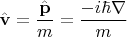 $$\hat{\mathbf{v}}=\dfrac{\hat{\mathbf{p}}}{m}=\dfrac{-i\hbar\nabla}{m}$$