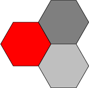 $$
\begin{tikzpicture}
  \draw[fill=red] (0,0) -- (1,0) -- (1.5,0.87) -- (1,1.74) -- (0,1.74) -- (-0.5,0.87) -- cycle;
\draw[fill=gray] (1.5,0.87) -- (2.5,0.87) -- (3,1.74) -- (2.5,2.61) -- (1.5,2.61) -- (1,1.74) -- cycle;
\draw[fill=lightgray] (1.5,-0.87) -- (2.5,-0.87) -- (3,0) -- (2.5,0.87) -- (1.5,0.87) -- (1,0) -- cycle;
\end{tikzpicture}
$$