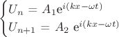 \begin{equation*}
 \begin{cases}
  U_{n}$ = $A_{1}$e^{i(kx - \omega t)}
   \\
   U_{n+1}$ = $A_{2}$ e^{i(kx - \omega t)}
    \end{cases}
\end{equation*}