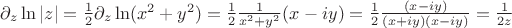 $\partial_z \ln|z|=\frac{1}{2}\partial_z \ln(x^2+y^2)=\frac{1}{2} \frac{1}{x^2+y^2}(x-iy)=\frac{1}{2} \frac{(x-iy)}{(x+iy)(x-iy)}=\frac{1}{2z}$