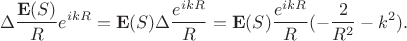 $$\Delta \frac{\mathbf{E}(S)}{R}e^{ikR} = \mathbf{E}(S)\Delta \frac{e^{ikR}}{R} =  \mathbf{E}(S)\frac{e^{ikR}}{R}(- \frac{2}{R^2} - k^2).$$