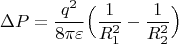 $$
\Delta P=\frac{q^2}{8\pi\varepsilon}\Big(\frac1{R_1^2}-\frac1{R_2^2}\Big)
$$