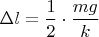 $\Delta l=\dfrac {1}{2} \cdot \dfrac{mg}{k}$